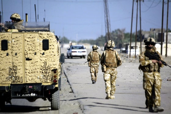 British soldiers patrol a street in the