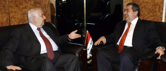 Syrian Foreign Minister Walid Muallem (L