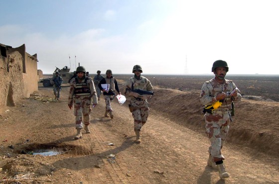 Iraqi army soldiers patrol an area in th