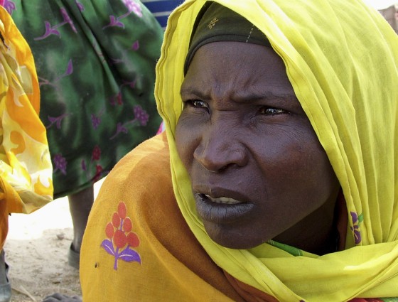A Sudanese refugee sits in Seneit near the Chad/Sudan border