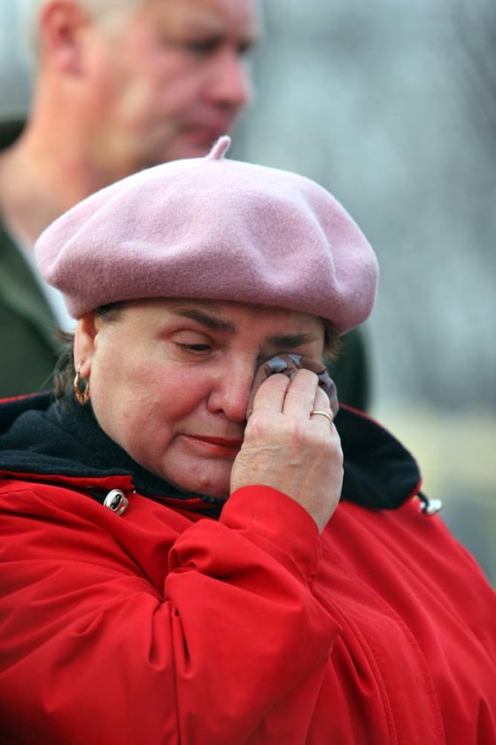 A woman cries in front of the Halemba coal mine, in Ruda Slaska, Poland, on Thursday, after 23 miners died in a mining accident.
