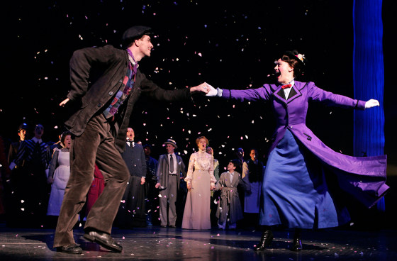 Mary Poppins characters Bert, left, played by Gavin Lee, and Mary Poppins played by Ashley Brown, dance on the stage together during the curtain call of opening night of the Broadway musical, Nov. 16, in New York.
