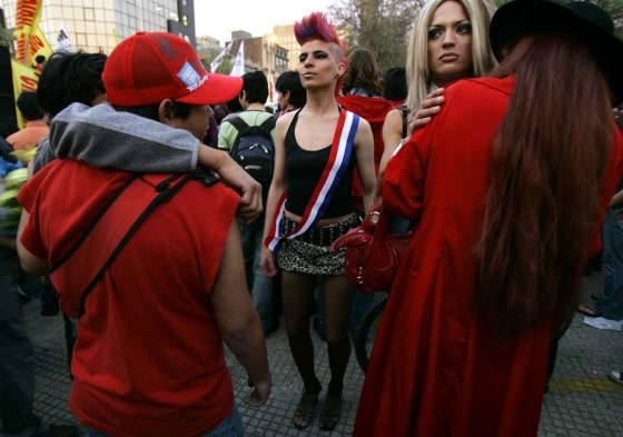 Gays and lesbians attend a Gay Parade hold in downtown Santiago to demand equal rights for gays and lesbians in Santiago, Chile, Saturday, Sept. 30, 2006.