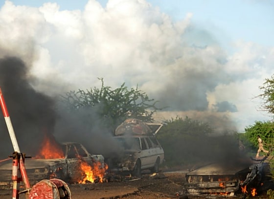 Cars burn Thursday after a bomb exploded at a checkpoint in Baidoa, Somalia.