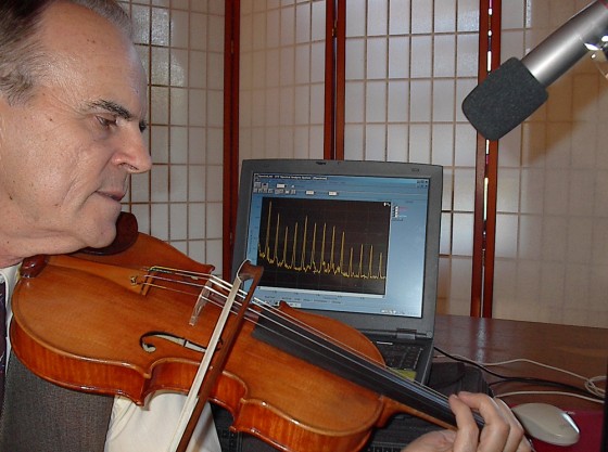Texas A&M researcher Joseph Nagyvary bows a new violin produced using the Cremona method of wood preservation. The sound quality of these violins is tested using fast Fourier transform analysis.