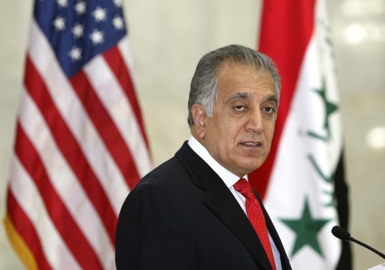 U.S. ambassador to Iraq Zalmay Khalilzad speaks during an oath of citizenship ceremony for U.S. soldiers in a U.S. military camp in Baghdad November 11, 2006. About 75 soldiers from 33 countries became U.S. citizens during the military naturalization ceremony at Camp Victory. REUTERS/Erik de Castro (IRAQ)