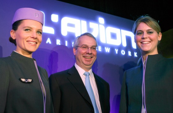 France's Marc Rochet of l'Avion airline poses with crew members during a news conference in Paris