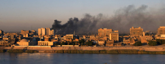 Smoke rises from the site where three ca