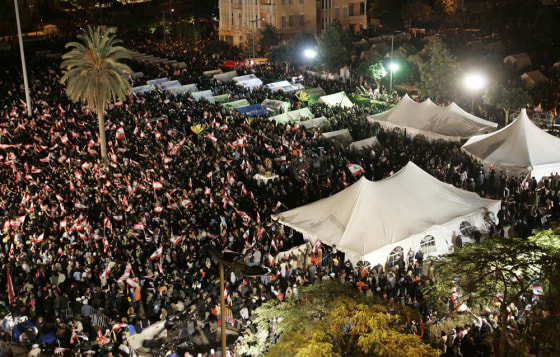 Hezbollah supporters gather for the second day of protests to force the resignation of Prime Minister Fuad Saniora in Beirut, Lebanon, on Saturday.