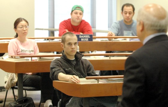 Notre Dame students listen to professor Jim O'Rourke during a lecture for his management writing course. 