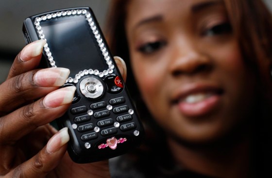 Nineteen-year-old Natavia Vineyard is seen with her black, blinged-out, feminine cell phone complete with rhinestones on both sides.