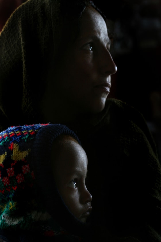 Farida and her son Amir Shah, 2, both addicted to opium, wait to receive treatment at the Nejat Center in Kabul, Afghanistan, on Tuesday.