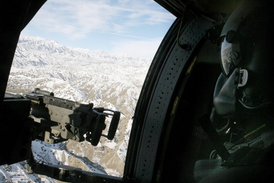 A US Blackhawk door-gunner loks out over