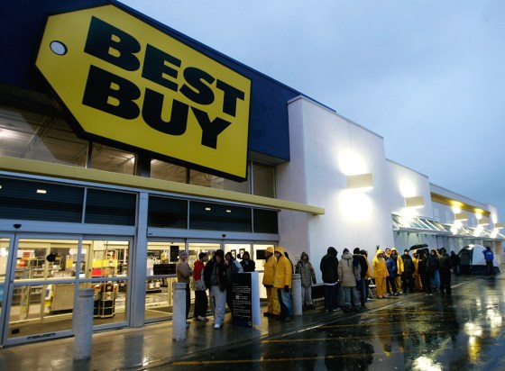 People wait in line early Nov. 17 to buy a new Sony Playstation 3 at a Best Buy in Toronto. Two R.I. police officers are being investigated for allegedly using their influence to skip ahead in line at an area Sony store on launch day. 