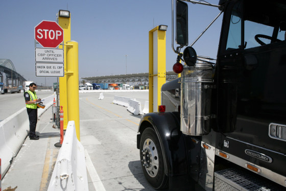 A Customs and Border Protection officer inspects a truck at a port for radioactive material. Cargo containers bound for the United States from six foreign seaports will be screened for dangerous nuclear materials.
