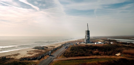 Surrounded by a gantry to protect it from the elements, the Minotaur I rocket, carrying a small experimental satellite for the Air Force and an even smaller one for NASA, sits on the launch pad at the Mid-Atlantic Regional Spaceport on Wallops Island, Va.