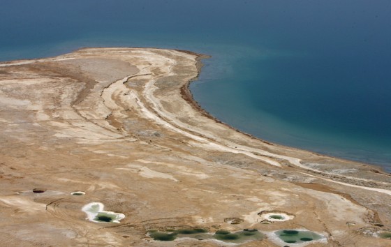 Traces of water are seen where the Dead Sea once reached, June 20, 2006.