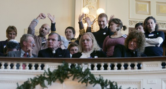 Supporters wave from the gallery as the civil unions bill is debated in the New Jersey Assembly on Thursday in Trenton, N.J.