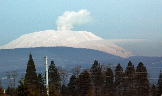 A steaming Mount St. Helens is seen from the roof of the Cascades Volcano Observatory in Vancouver, Wash. Cold weather combined with the ongoing release of water vapor generated an impressive steam plume Tuesday at Mount St. Helens, which has been undergoing a low-key eruption since September 2004.