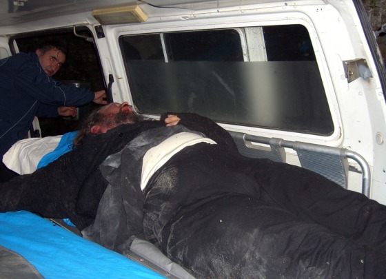 An unidentified monk is moved in an ambulance on Wednesday after clashes at the Orthodox monastic sanctuary of Mount Athos, in northern Greece.