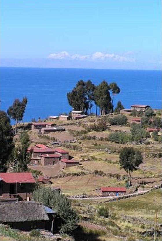 Mountains in neighboring Bolivia are seen from a high point on the island of Taquile, near Puno, Peru.