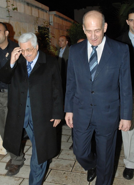 Israeli Prime Minister Ehud Olmert, right, walks with Palestinian Authority President Mahmoud Abbas prior to a meeting at Olmert's official residence in Jerusalem on Saturday.