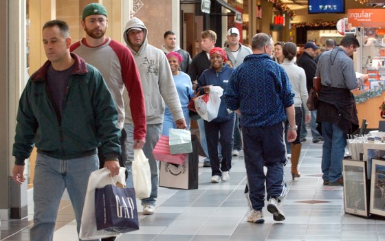Those who wait: Last-minute Christmas shoppers make their way through the Northshore Mall, Sunday in Peabody, Mass on Sunday.