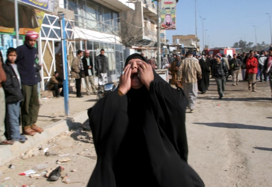 An Iraqi woman cries near the explosion in Kufa, 100 miles south of Baghdad, Iraq, on Saturday.