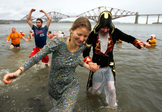 Swimmers in fancy dress take part in Looney Dook mid winter swim at South Queensferry Scotland