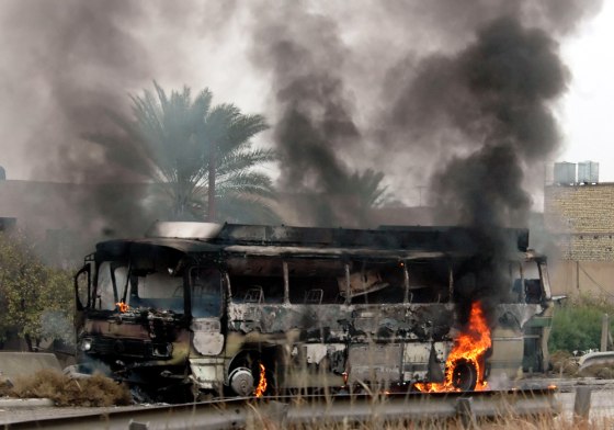 Unknown gunmen attacked a bus full of mainly Shiite workers en route to the Baghdad airport on Monday. More than a dozen people were killed.