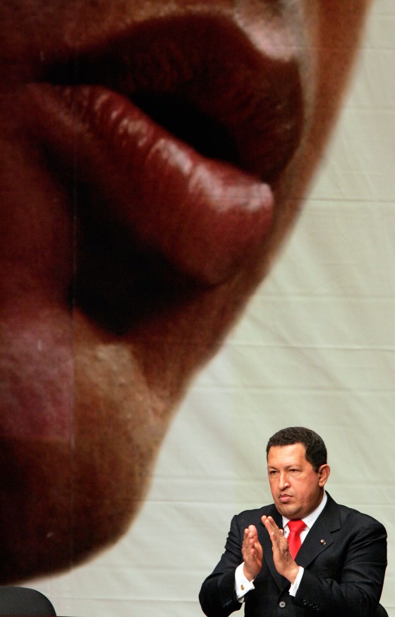 Venezuela's President Hugo Chavez claps at the swearing-in ceremony for new ministers in Caracas