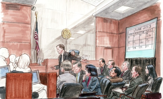 Special Counsel Patrick Fitzgerald addresses the jury, gesturing toward I. Lewis Libby (third from right).