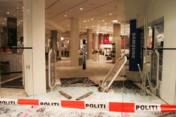 Police in Copenhagen, Denmark, have secured the scene of an attempted robbery in which the would-be thieves raced their car through the ground floor of a department store.