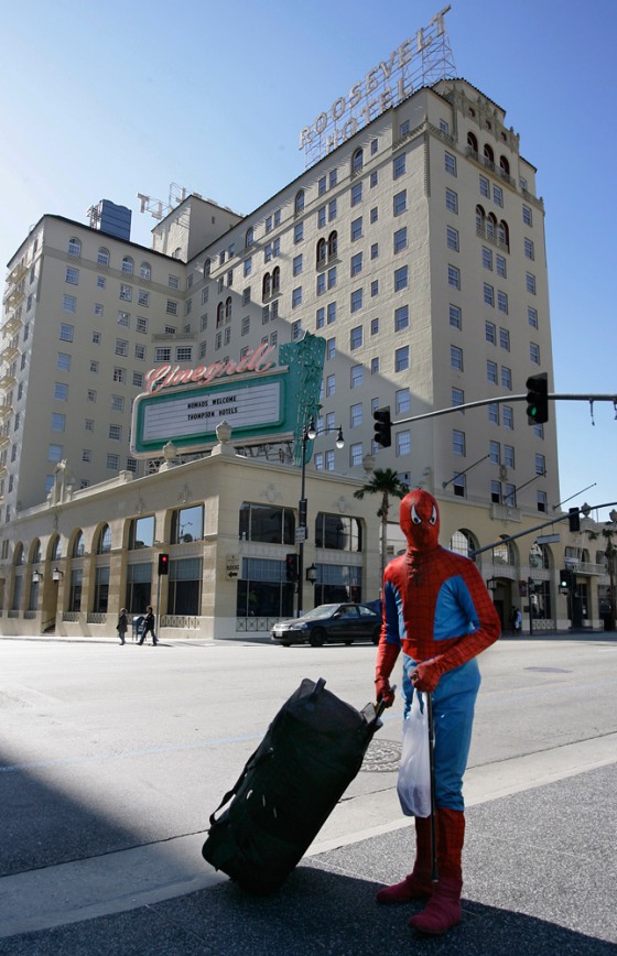 A Spiderman impersonator crosses the street with his luggage near the Roosevelt Hotel in Hollywood. The hotel is a perfect spot to get a sneak peak at stars attending the 79th annual Academy Awards on Feb. 25.