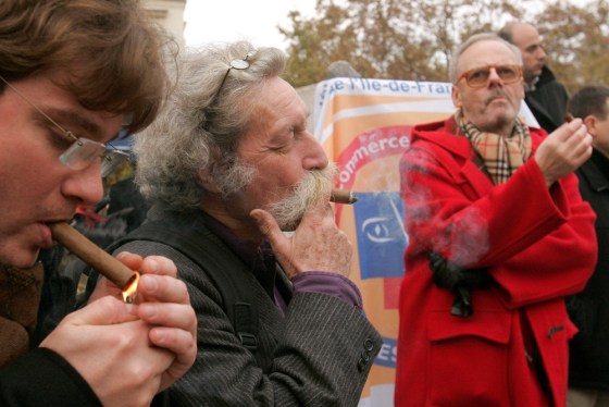 French tobacco vendors smoke cigars in Paris on Nov. 6 during a demonstration against the ban of smoking in public places and restaurants.