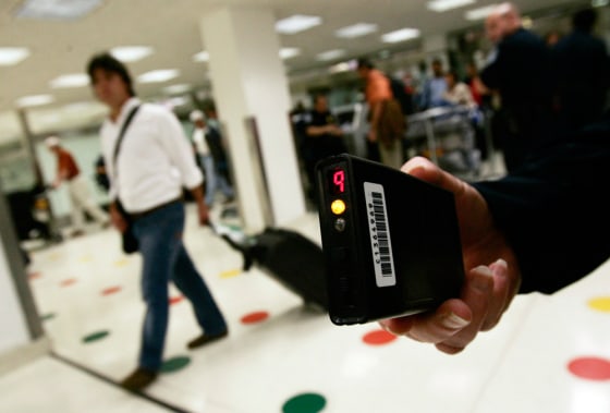 US Customs and Border Protection officer holds a radiation detector at Miami International airport