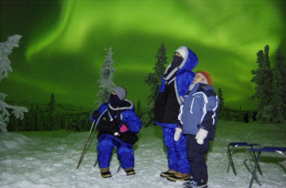 Tomoka Mizutani, 7, right, her mother Keiko, 36, middle, and her grandmother Ikuko Sugiur, 64, left, of Okazaki, Japan, watch the northern lights dance in the sky near Fairbanks Alaska. At least 3,500 tourists are scheduled to take advantage of 10 direct charter flights from Tokyo, Osaka and Nagoya to Fairbanks during the auora season. 