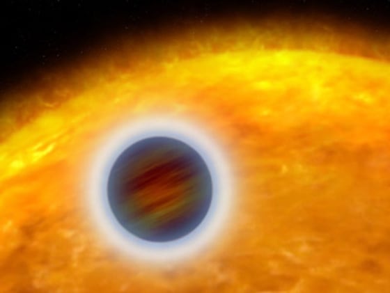 This artist's illustration shows the Jupiter-size, extrasolar planet, called HD 209458b, orbiting close to its star. Starlight heats the planet's atmosphere, causing hot gas to escape into space.