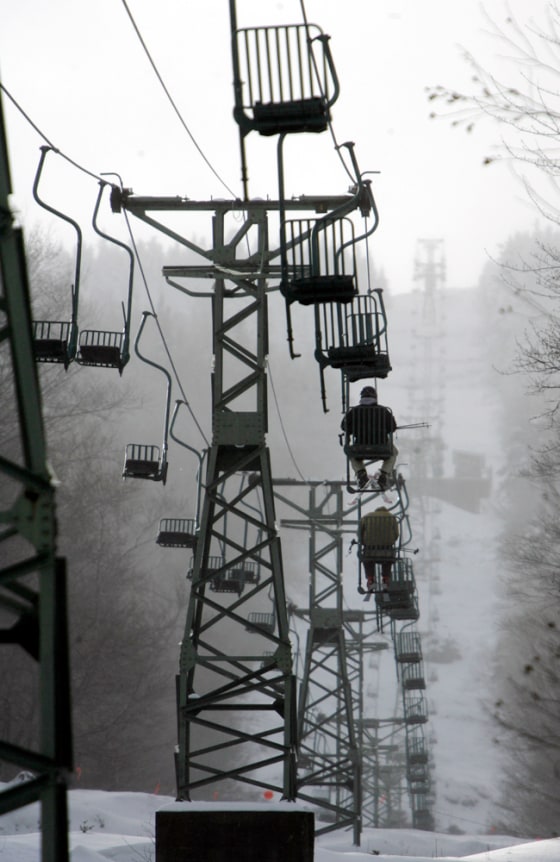 Skiers ride the Mad River ski area single chair lift in Fayston, Vt. The 158-chair lift, one of only two still in operation in the U.S., is being replaced in a $1.5 million renovation that will be financed in part by auctioning off the chairs to nostalgic skiers. More are on the way, though: The new lift will also be a single.