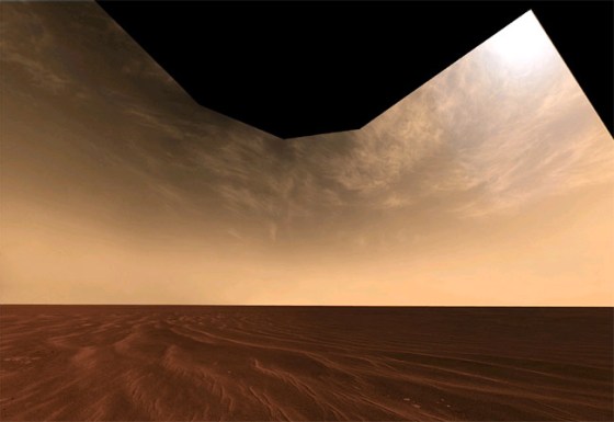 Opportunity rover snapped a picture of a vast, sandy plain and high-flying clouds while exploring Mars' Victoria Crater last October.