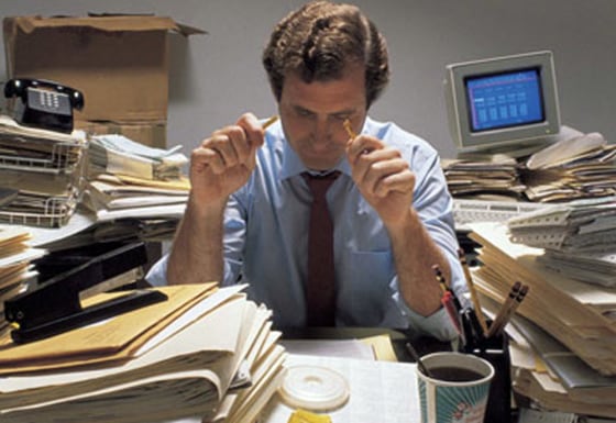 Men are more likely than women to put up with crazy working hours according to a survey.