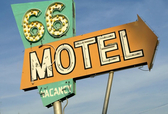 The sign outside the 66 Motel is shown in Needles, Calif. While travelers on a long-haul driving trip probably don't want a posh stay at a nice botique, honeymooners also don't want a stay right off the Interstate.