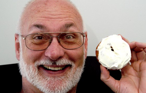 Scientist Robert Bohannon holds a doughnut covered in caffeine icing in his office in Durham, N.C. last month.