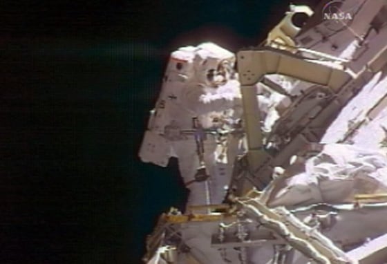 Two U.S. astronauts stepped outside the international space station to carry out a series of maintenance tasks at the orbiting outpost, their third venture out in nine days.