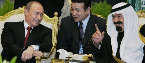 Russian President Vladimir Putin (L) spe