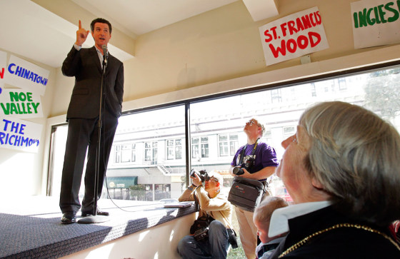 San Francisco Mayor Gavin Newsom (L) speaks at the official opening of his campaign headquarters in San Francisco