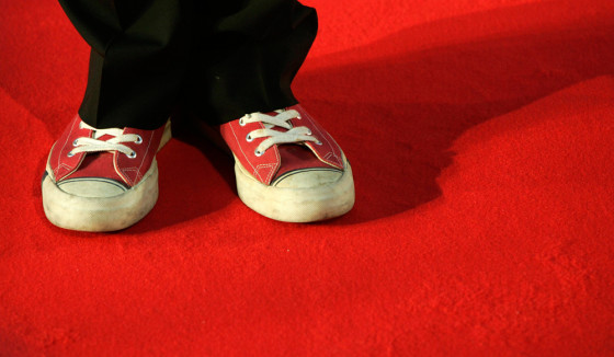 Director Stephen Frears wears red sports shoes as he arrives for the BAFTA awards in London
