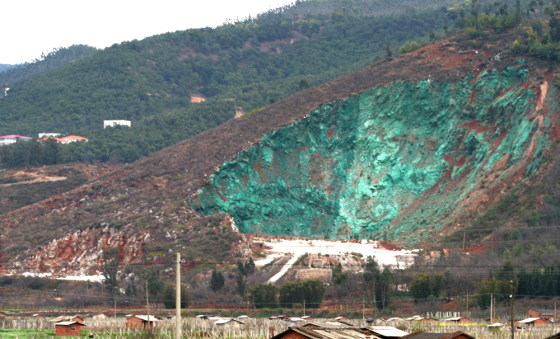 The paint job applied to an abandoned quarry in southwest China stands out with its aquamarine color.
