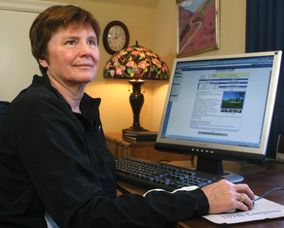 Nancy Atwater shows the web page of her home outside Sperry, Okla. She and her husband Mike participate in the home exchange vacation program through Homelink USA and have swapped their home with others as far away as Lancaster England.