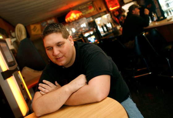 Joshua Hanson talks Tuesday at his bar in Blair, Wis., about the before and after of his 16-story fall.